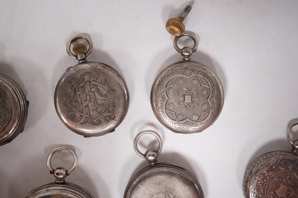 Three early to mid 20th century silver open faced pocket watches, with Roman or Arabic dials and subsidiary seconds, including two keyless and one key wind (Admiral Tacy Watch Co), together with one smaller silver open f